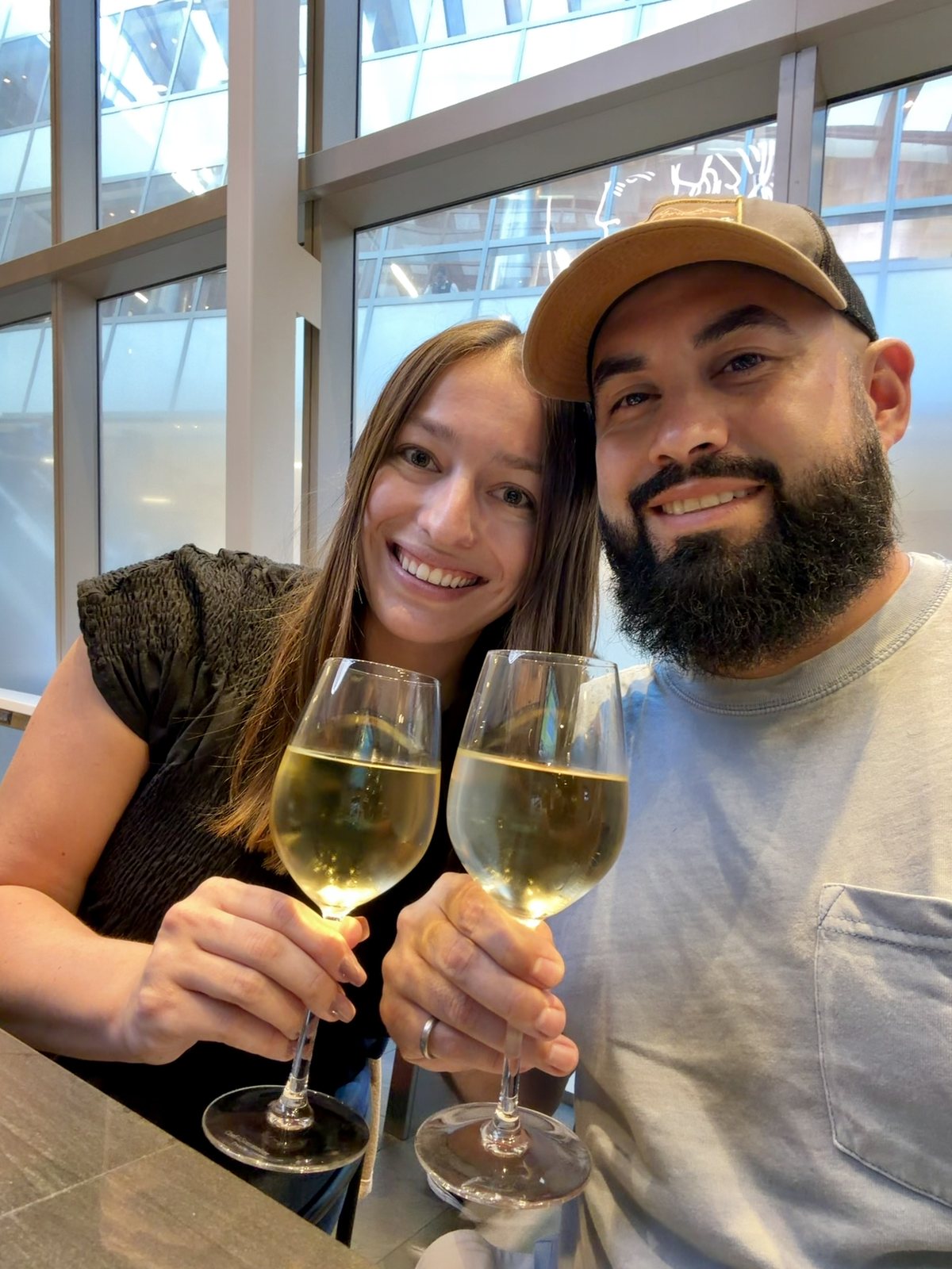 the two of us at the airport or on the train, bleary but happy